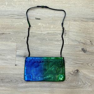 CHRISTIAN LOUBOUTIN AUTHENTIC CLUTCH HOLOGRAPHIC LEATHER. USED.